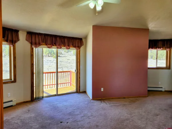a kitchen with stainless steel appliances granite countertop a stove a sink and a window