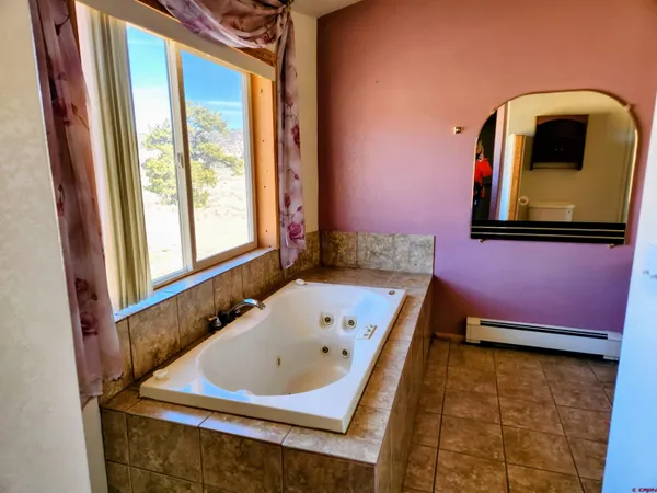 a view of a balcony with wooden floor