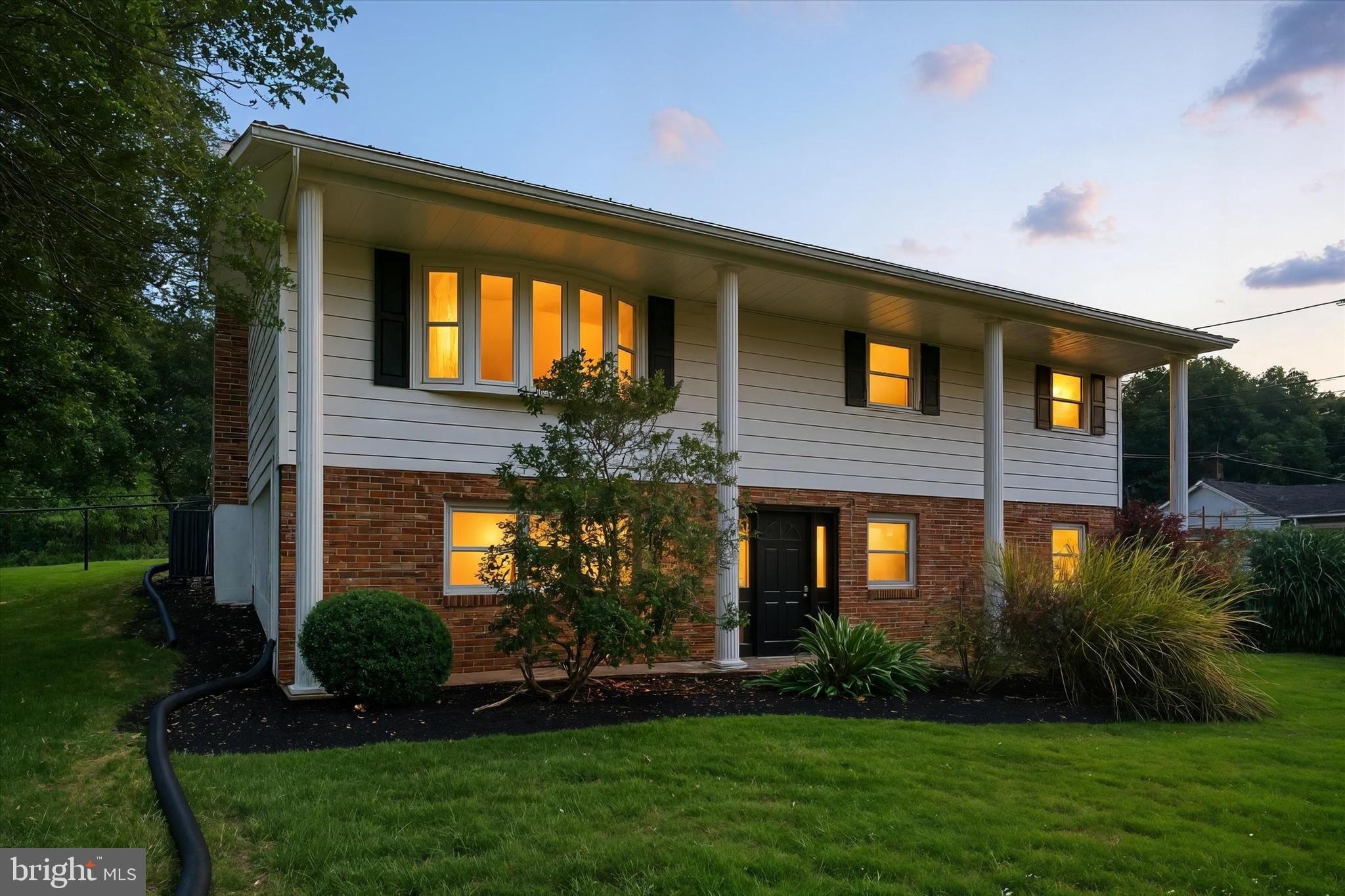 5206 Rockery Road Spring Grove, PA 17362 - Photo 1 of 28 a front view of a house with garden