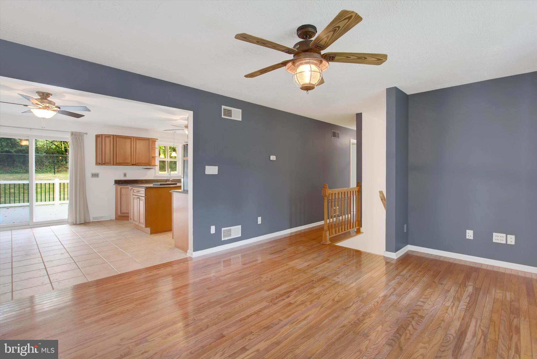5206 Rockery Road Spring Grove, PA 17362 - Photo 11 of 28 a view of a livingroom with a ceiling fan hardwood floor and a ceiling fan