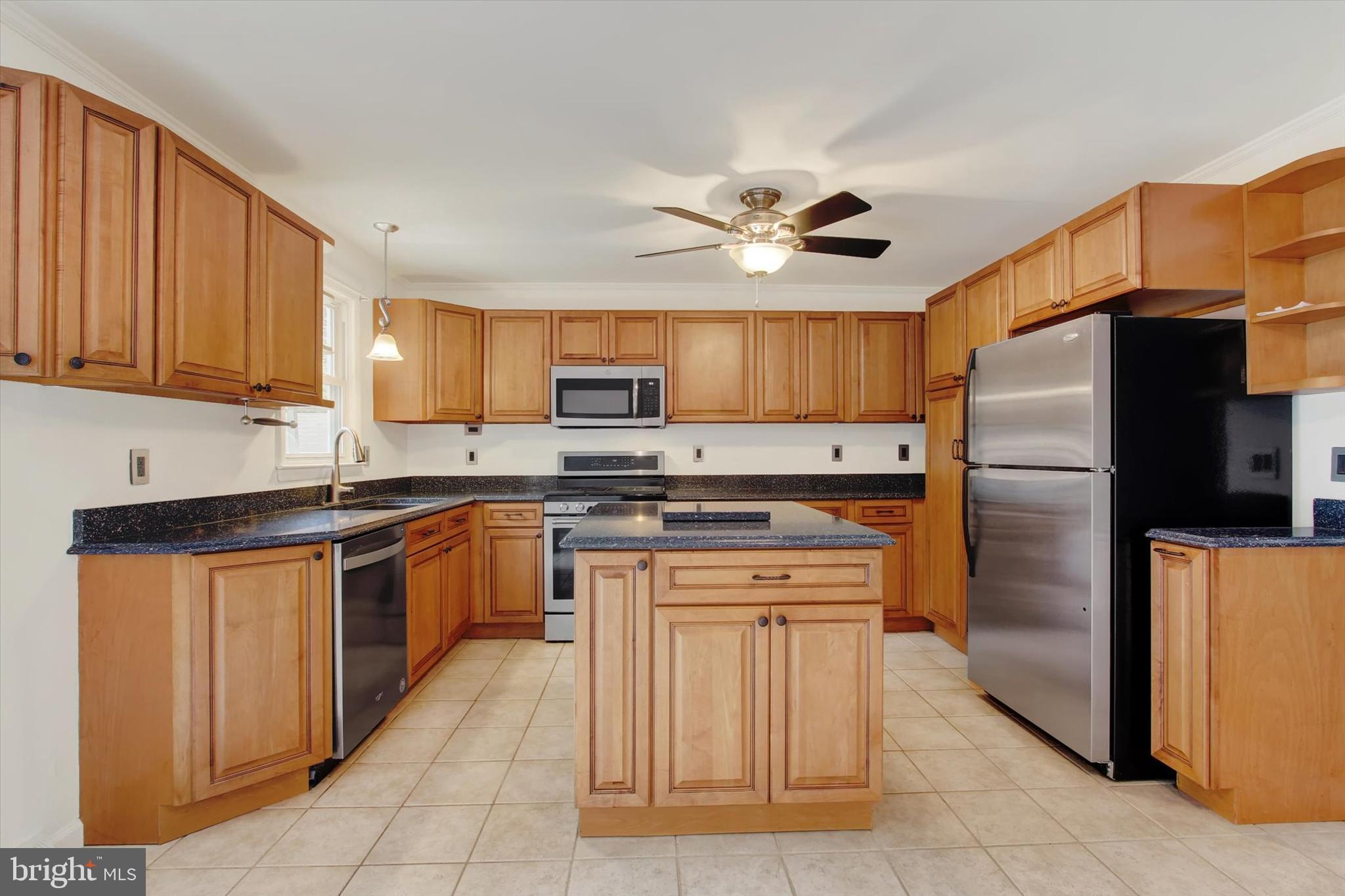5206 Rockery Road Spring Grove, PA 17362 - Photo 14 of 28 a kitchen with stainless steel appliances granite countertop a refrigerator stove a sink and dishwasher