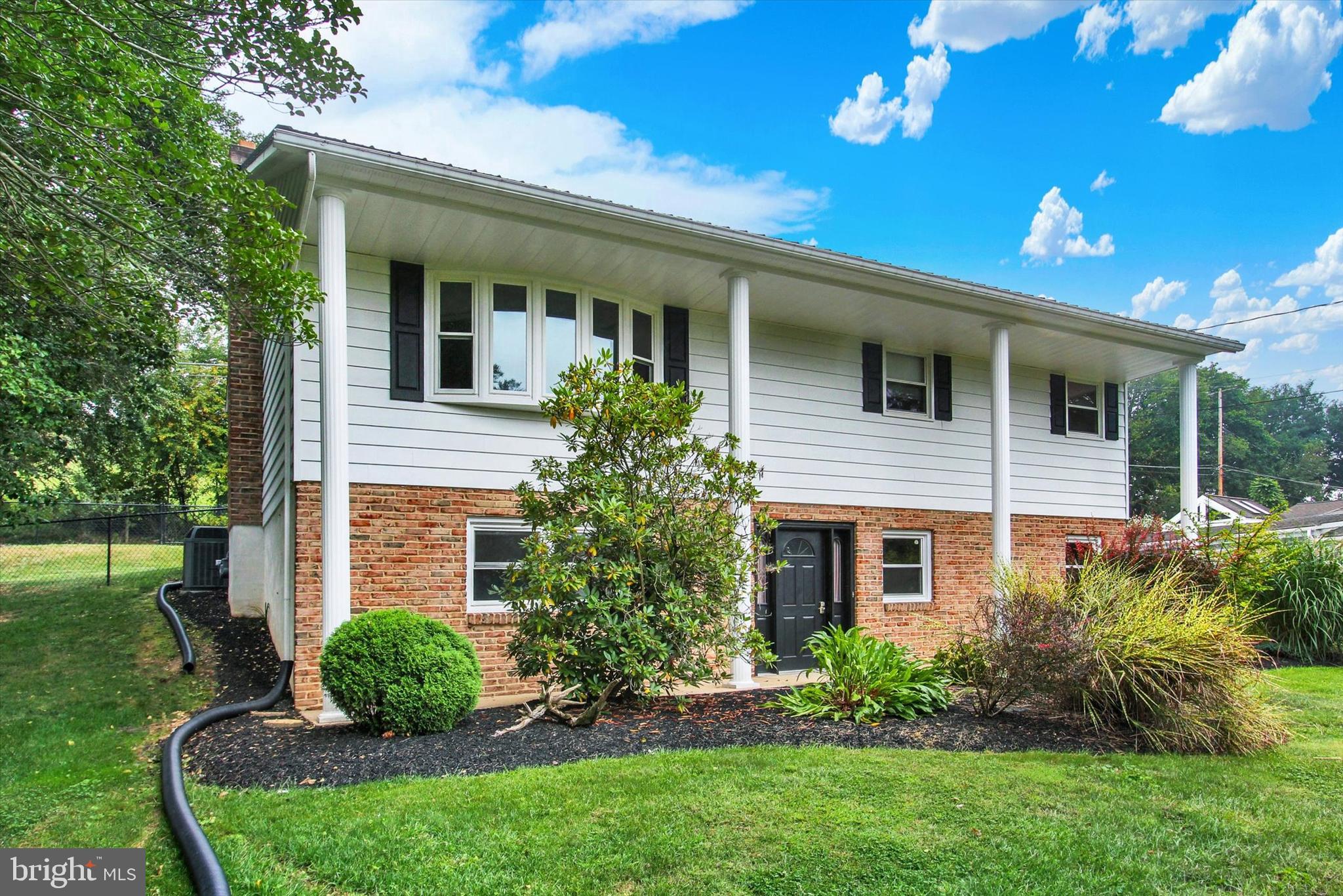 5206 Rockery Road Spring Grove, PA 17362 - Photo 2 of 28 a view of a house with a yard and plants