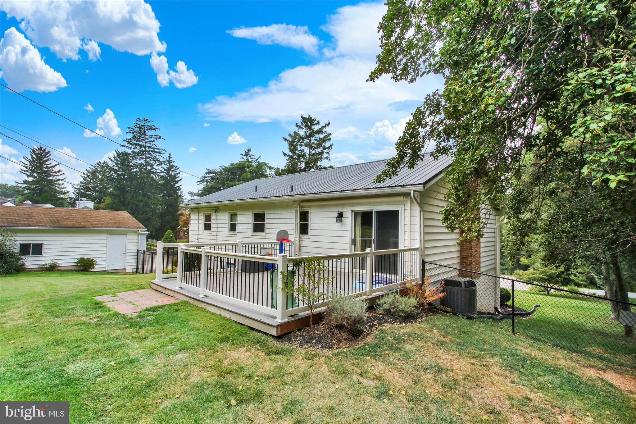 5206 Rockery Road Spring Grove, PA 17362 - Photo 24 of 28 a view of a house with a big yard and large trees