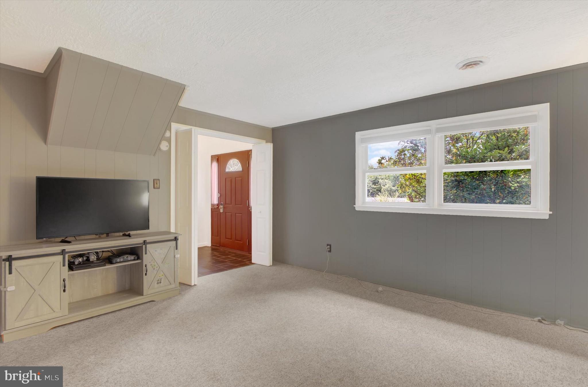 5206 Rockery Road Spring Grove, PA 17362 - Photo 5 of 28 a view of a livingroom with furniture and a flat screen tv