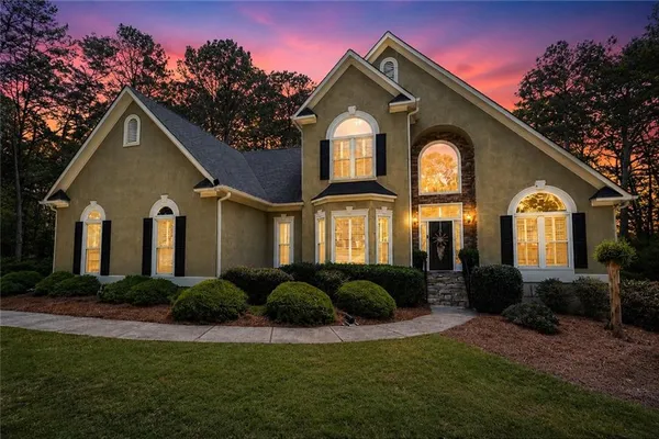 a front view of a house with a yard