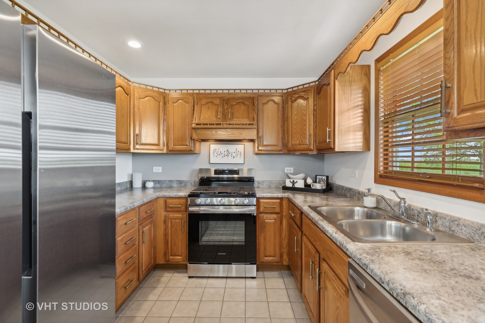 1444 East Corning Road Beecher, IL 60401 - Photo 12 of 33 a kitchen with stainless steel appliances granite countertop a sink stove and refrigerator