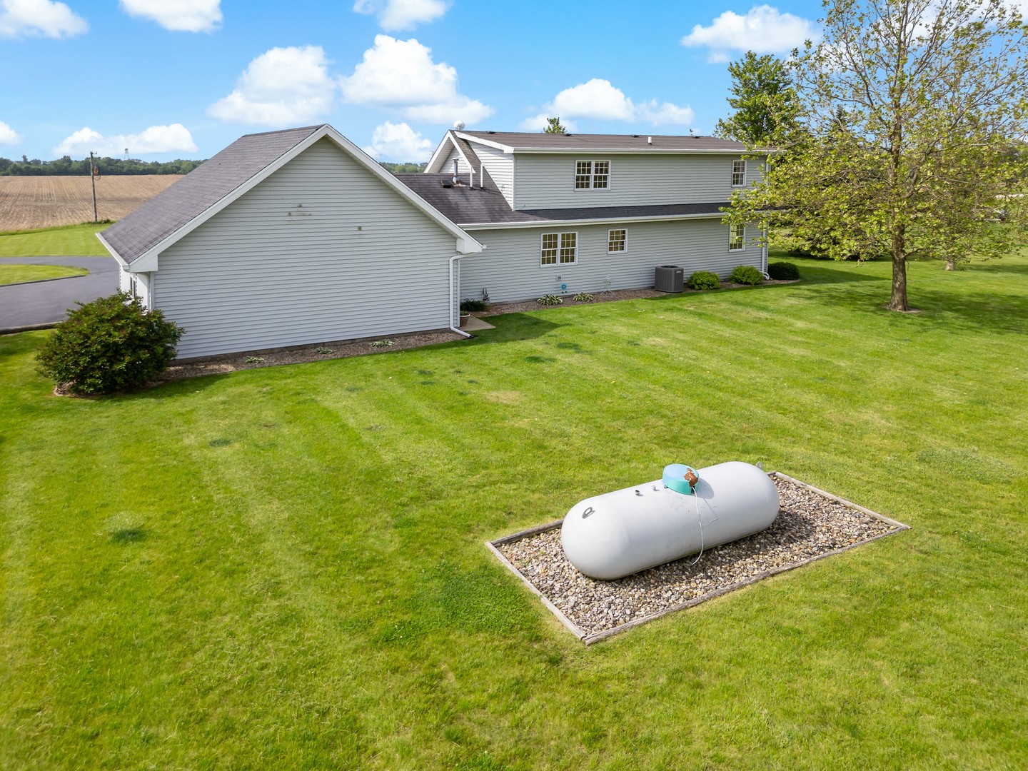 1444 East Corning Road Beecher, IL 60401 - Photo 5 of 33 a front view of a house with a yard