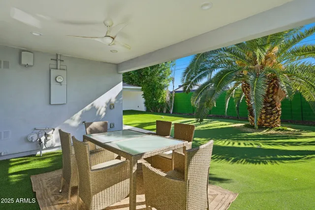 a view of yard from deck area with seating area