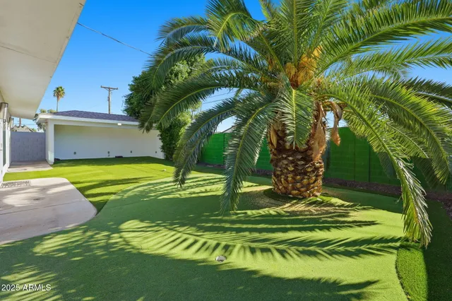 a view of swimming pool with a yard