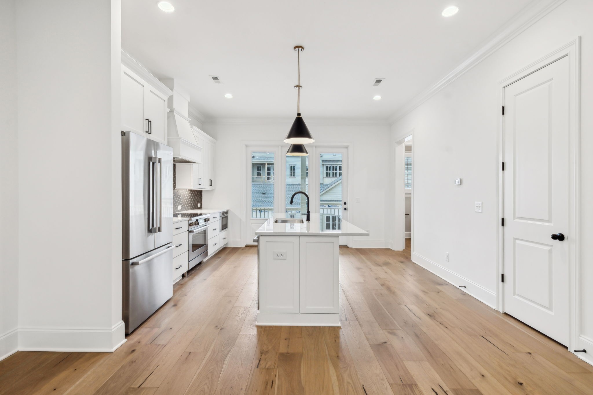 3012 Wynn Circle Franklin, TN 37064 - Photo 13 of 66 a kitchen with stainless steel appliances granite countertop a refrigerator a oven a stove and white cabinets with wooden floor