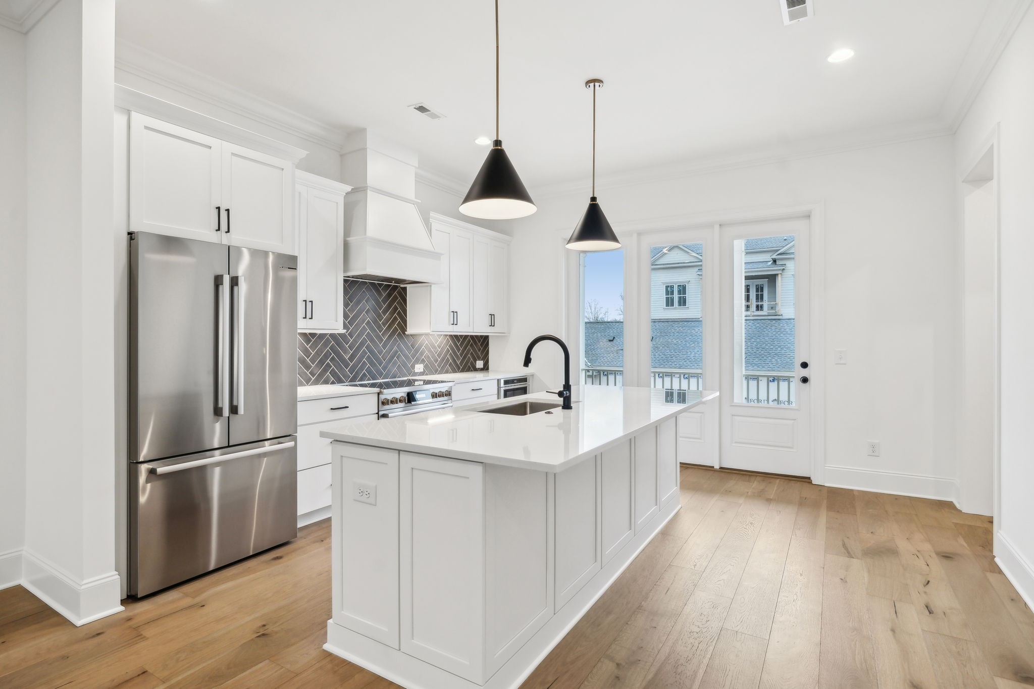 3012 Wynn Circle Franklin, TN 37064 - Photo 15 of 66 a kitchen with stainless steel appliances granite countertop a sink refrigerator and wooden floor