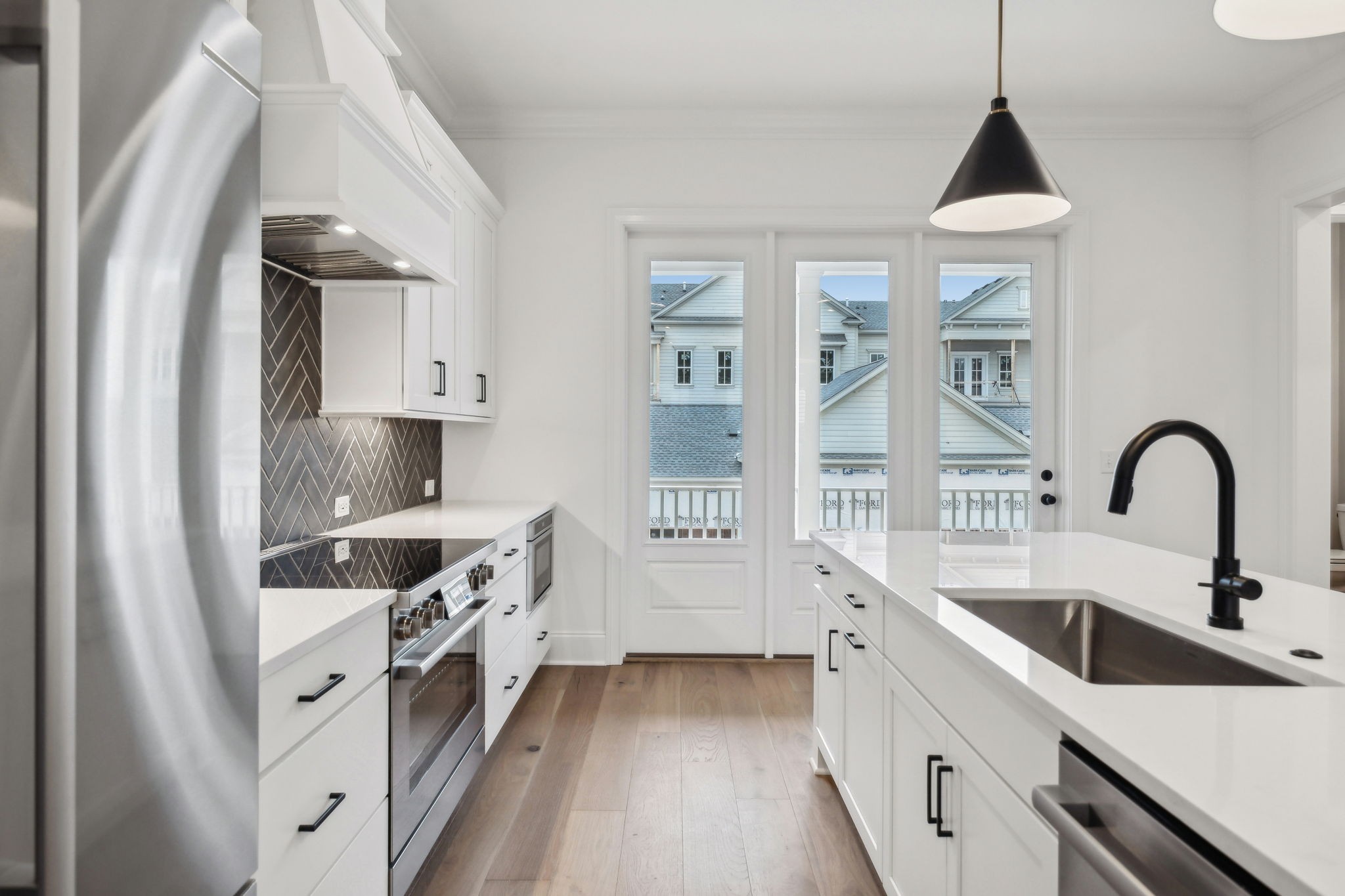 3012 Wynn Circle Franklin, TN 37064 - Photo 16 of 66 a kitchen with stainless steel appliances a sink a stove and a wooden floors