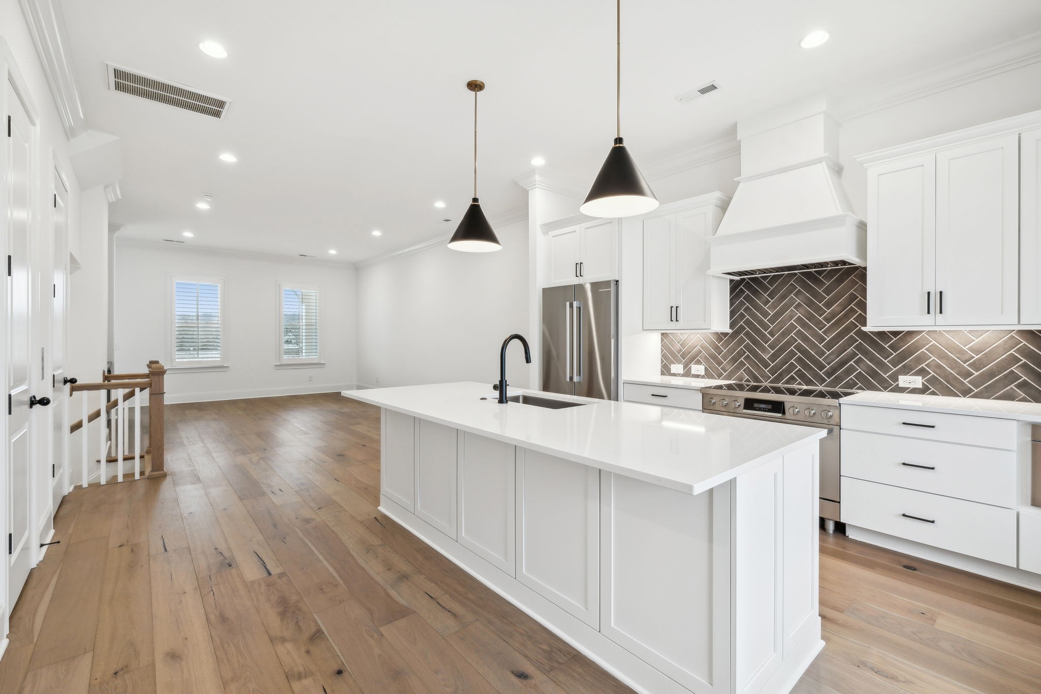 3012 Wynn Circle Franklin, TN 37064 - Photo 20 of 66 a kitchen with white cabinets appliances and a wooden floor