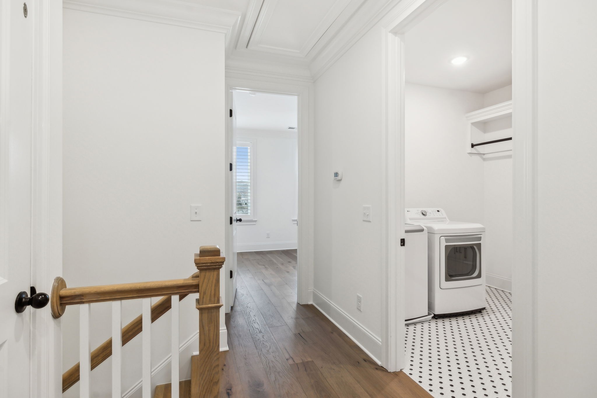 3012 Wynn Circle Franklin, TN 37064 - Photo 31 of 66 a view of a hallway with wooden floor and staircase