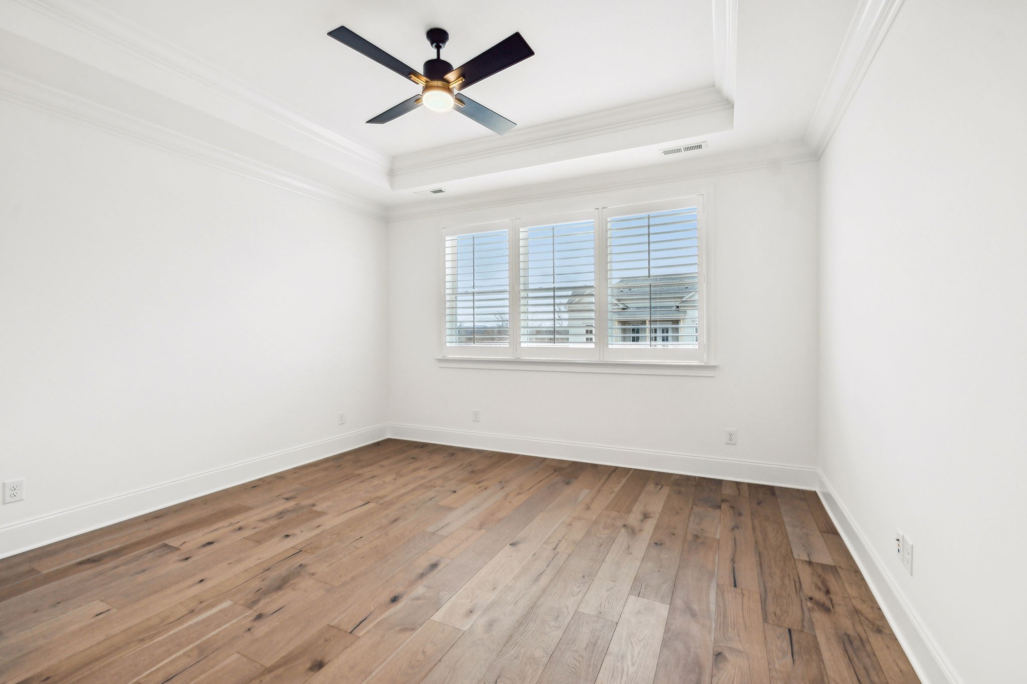 3012 Wynn Circle Franklin, TN 37064 - Photo 32 of 66 an empty room with wooden floor ceiling fan and windows