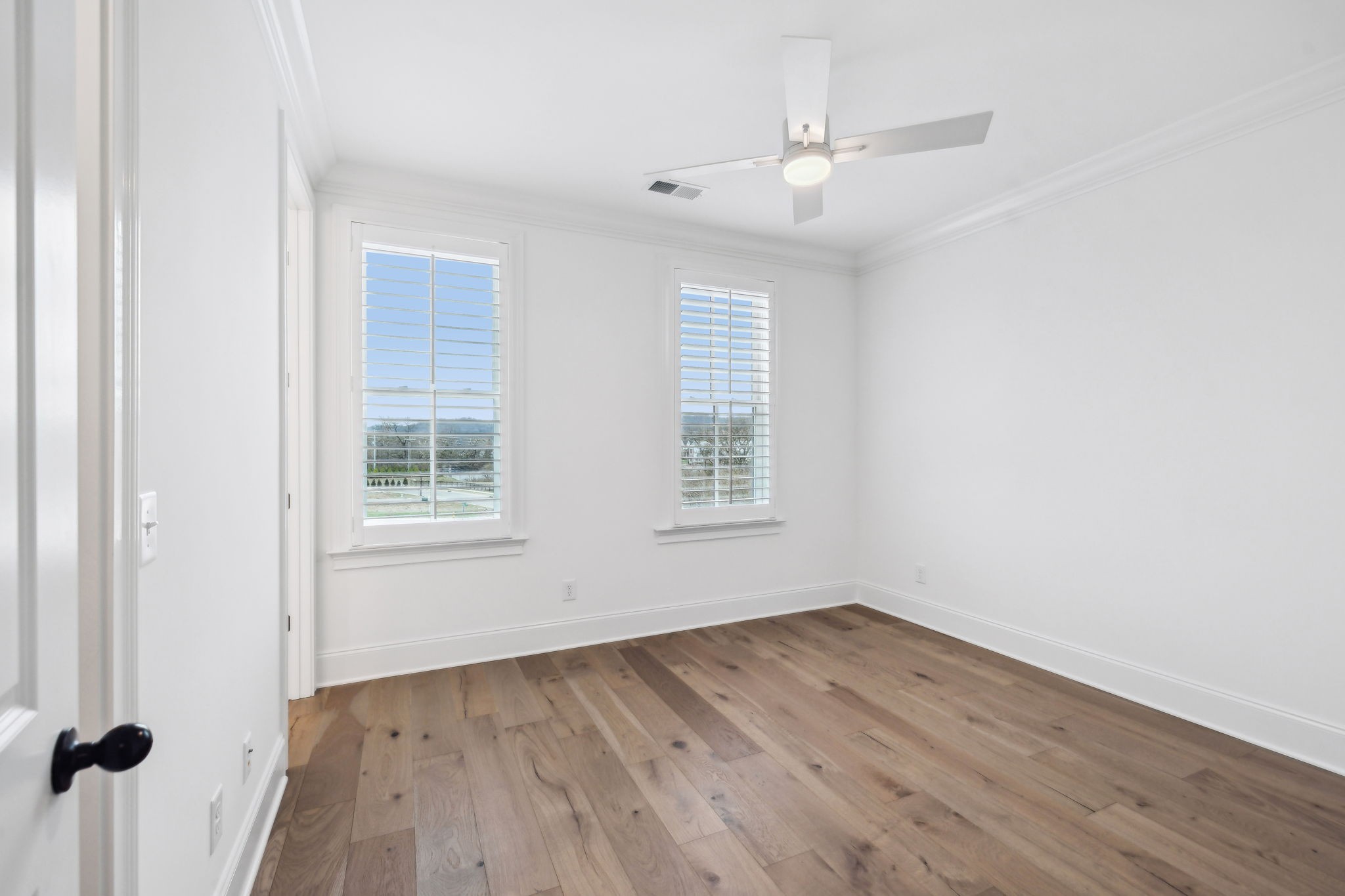 3012 Wynn Circle Franklin, TN 37064 - Photo 38 of 66 an empty room with wooden floor fan and windows