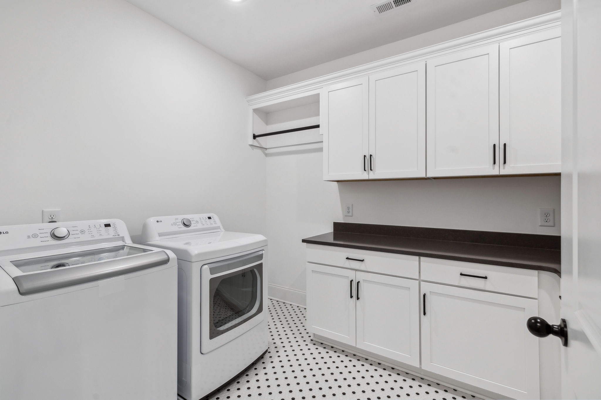3012 Wynn Circle Franklin, TN 37064 - Photo 41 of 66 a utility room with stainless steel appliances white cabinets and stove top oven