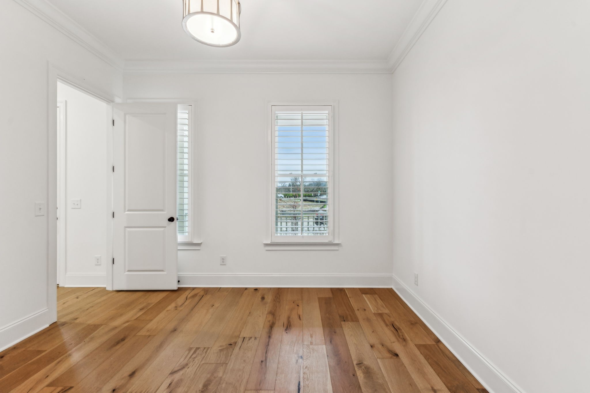 3012 Wynn Circle Franklin, TN 37064 - Photo 9 of 66 an empty room with wooden floor and windows