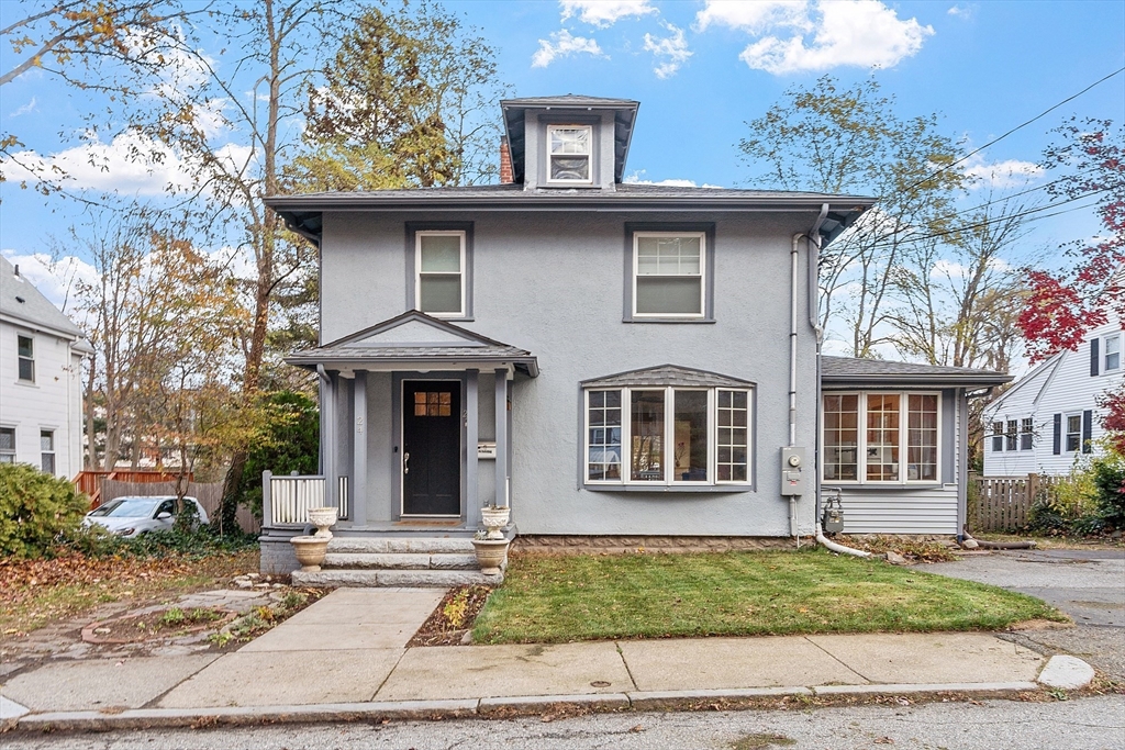 a front view of a house with garden