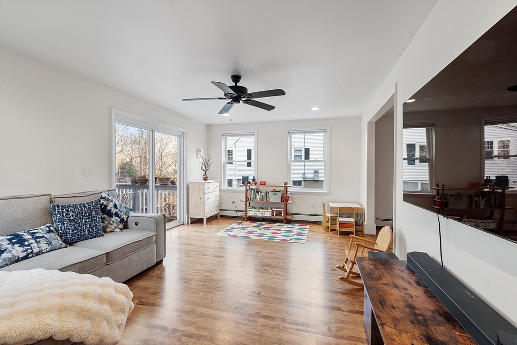 24 Myrtle Avenue Wakefield, MA 01880 - Photo 14 of 39 a living room with furniture or couch and a large window