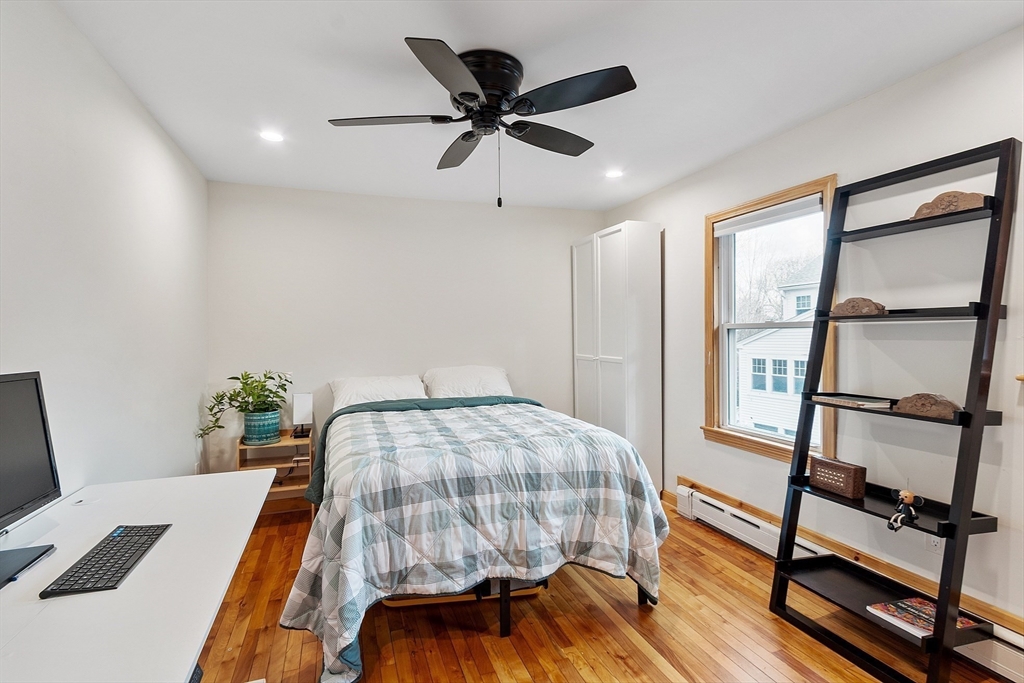 24 Myrtle Avenue Wakefield, MA 01880 - Photo 17 of 39 a bedroom with a bed and a desk