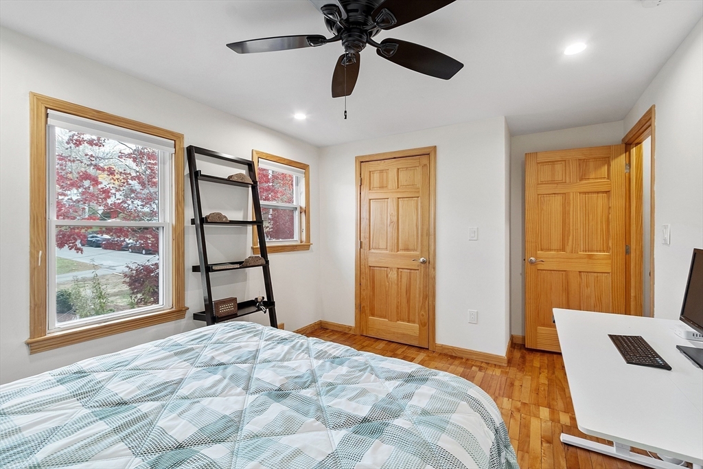 24 Myrtle Avenue Wakefield, MA 01880 - Photo 18 of 39 a bedroom with a bed closet and flat screen tv