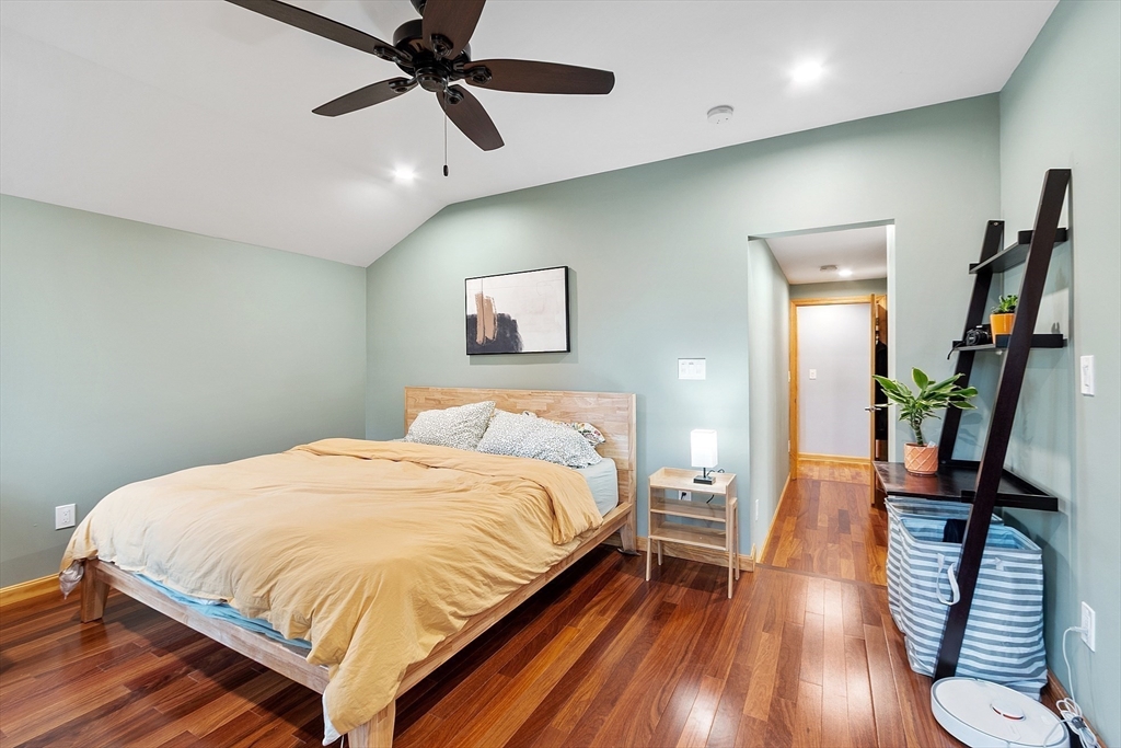 24 Myrtle Avenue Wakefield, MA 01880 - Photo 20 of 39 a bedroom with a bed and wooden floor