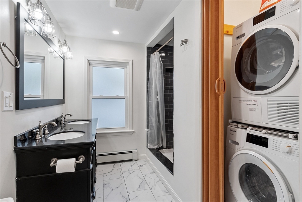 24 Myrtle Avenue Wakefield, MA 01880 - Photo 22 of 39 a bathroom with a sink a washer and dryer