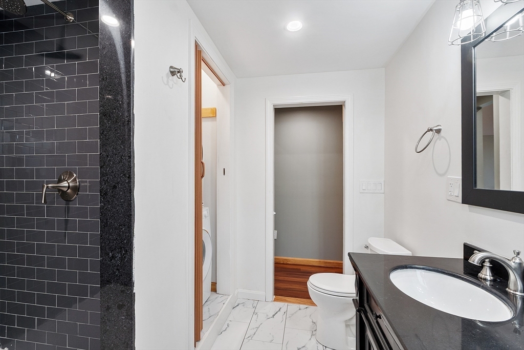 24 Myrtle Avenue Wakefield, MA 01880 - Photo 23 of 39 a bathroom with a sink and a mirror
