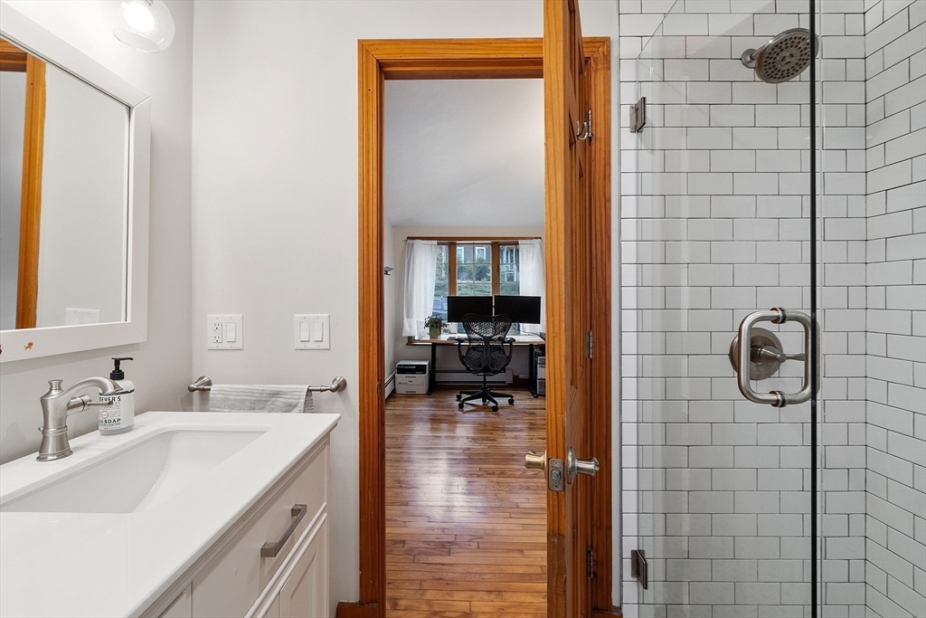24 Myrtle Avenue Wakefield, MA 01880 - Photo 28 of 39 a en suite bathroom with a sink and mirror