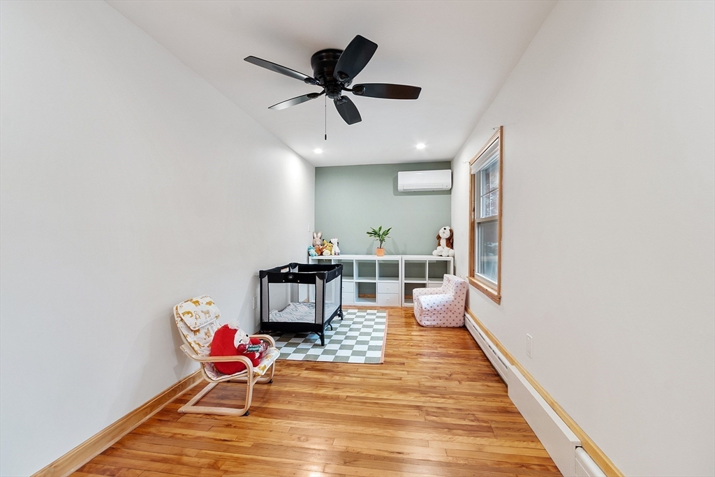 24 Myrtle Avenue Wakefield, MA 01880 - Photo 29 of 39 a living room with furniture and a wooden floor