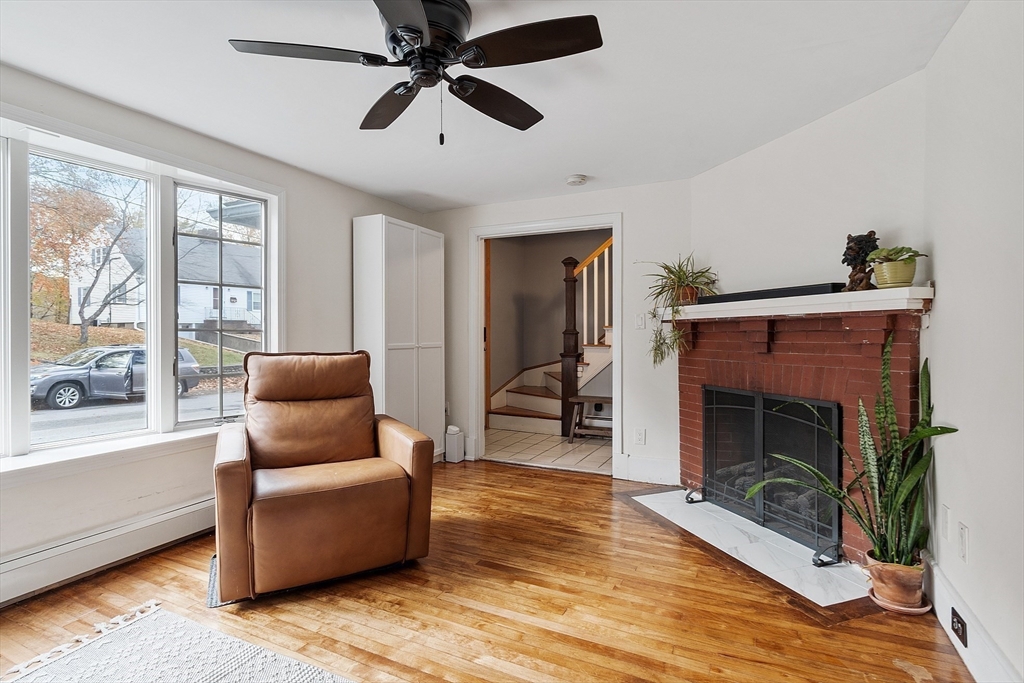 24 Myrtle Avenue Wakefield, MA 01880 - Photo 7 of 39 a living room with furniture and a fireplace