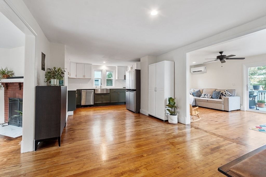 24 Myrtle Avenue Wakefield, MA 01880 - Photo 9 of 39 a view of a living room kitchen with furniture and wooden floor