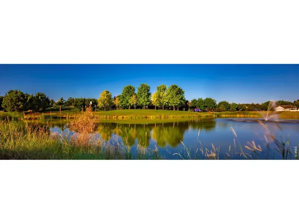 a living room with kitchen island furniture and wooden floor