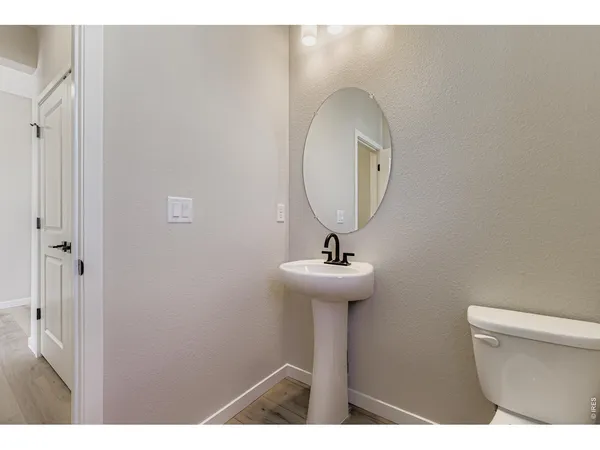 a open kitchen with stainless steel appliances granite countertop a sink a stove and a wooden floors