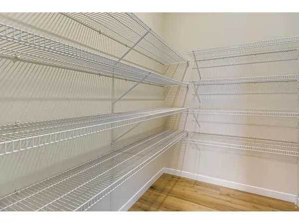 a kitchen with kitchen island a sink appliances and cabinets