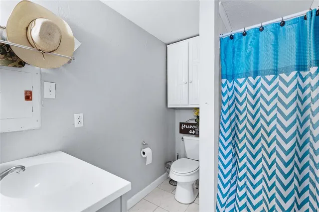 a bathroom with a sink a toilet and vanity