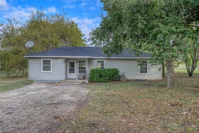 front view of house with a yard