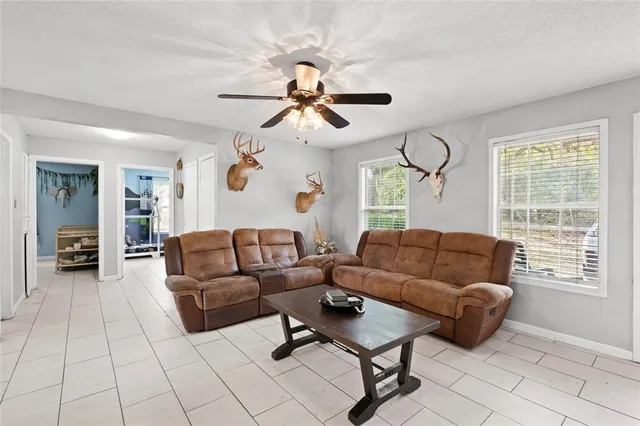 a living room with furniture and a window