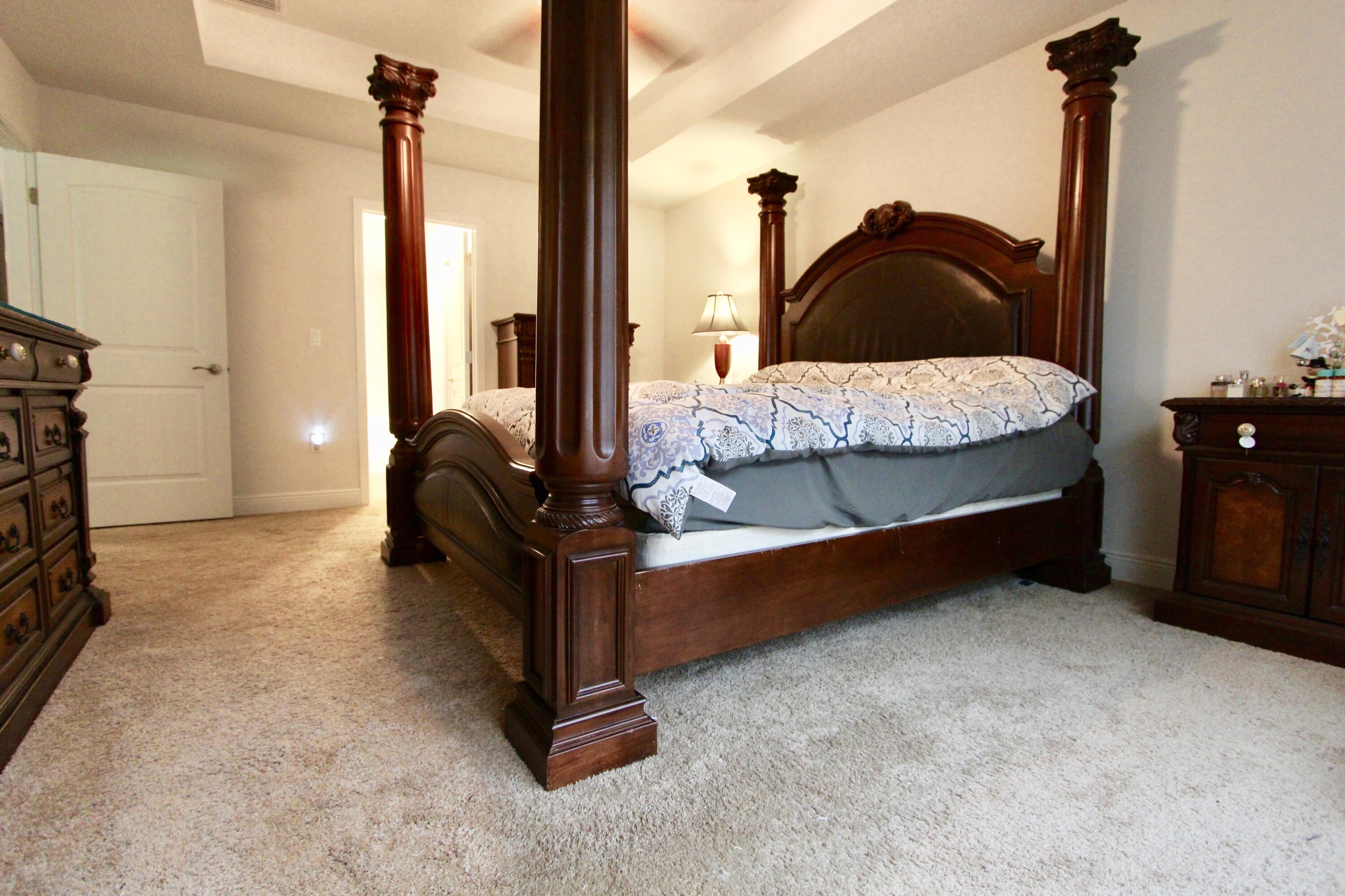 5759 Marigold Loop Crestview, FL 32539 - Photo 16 of 29 a bedroom with a bed and a night stand