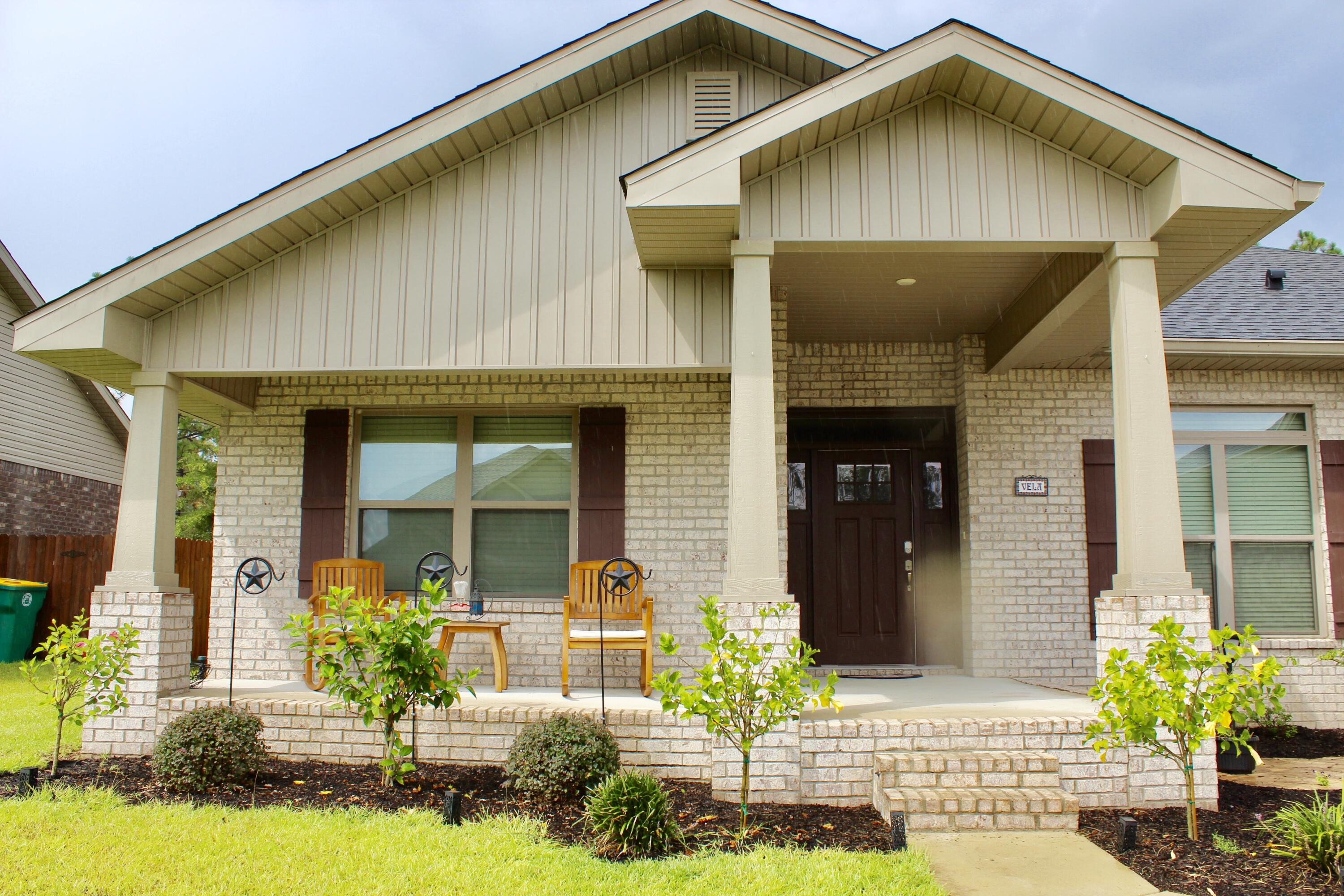 5759 Marigold Loop Crestview, FL 32539 - Photo 2 of 29 a front view of a house with a yard
