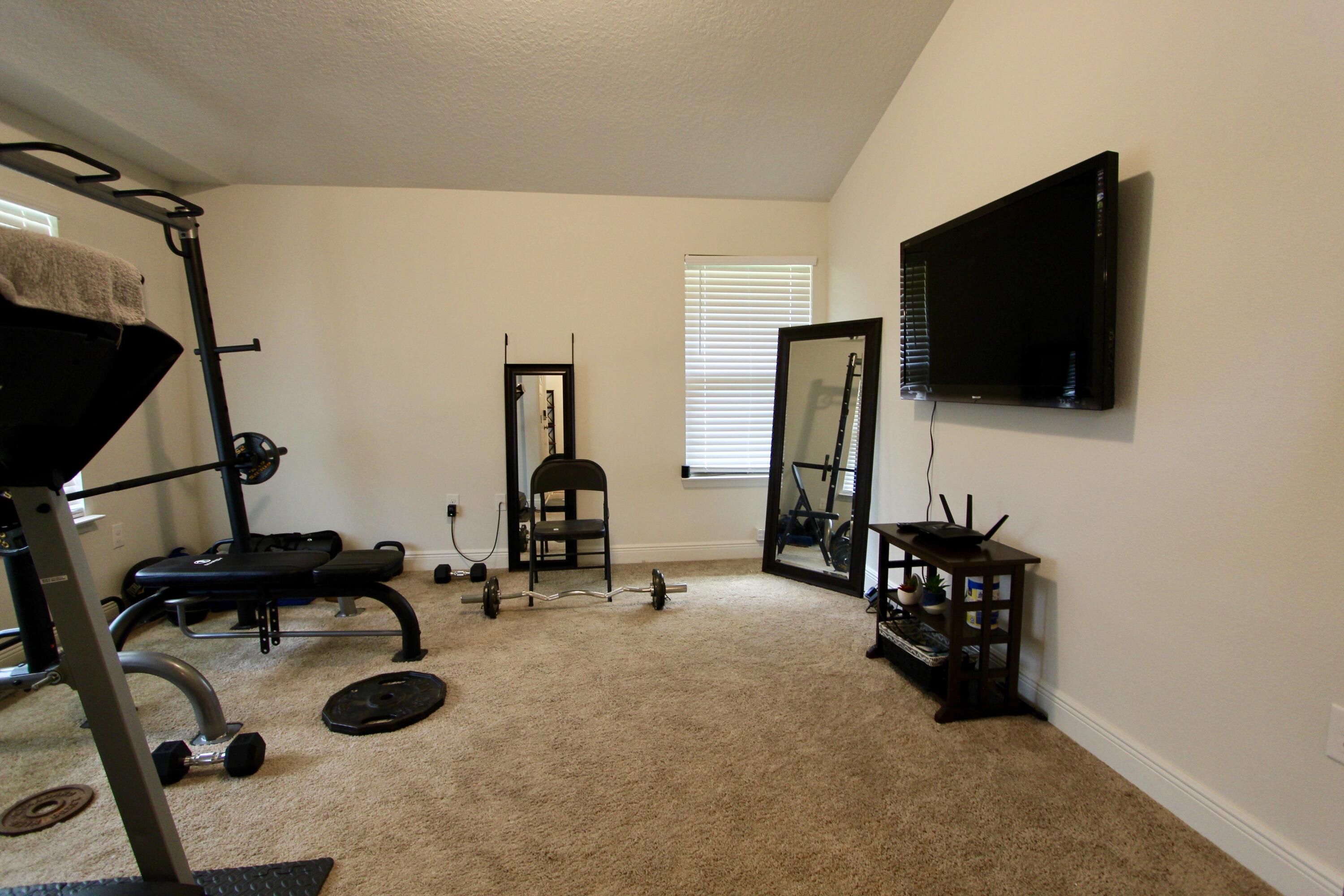 5759 Marigold Loop Crestview, FL 32539 - Photo 22 of 29 a view of a livingroom with furniture and a flat screen tv
