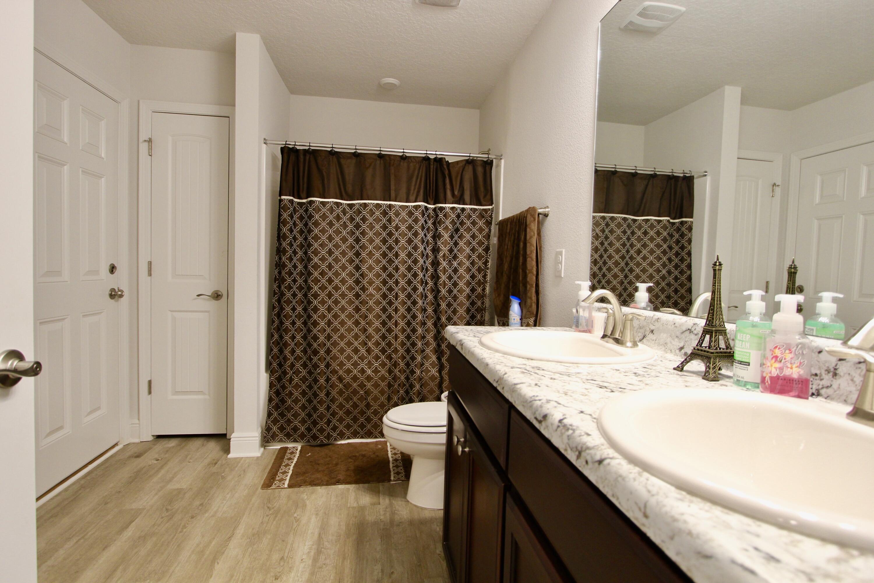 5759 Marigold Loop Crestview, FL 32539 - Photo 26 of 29 a bathroom with a sink toilet and shower