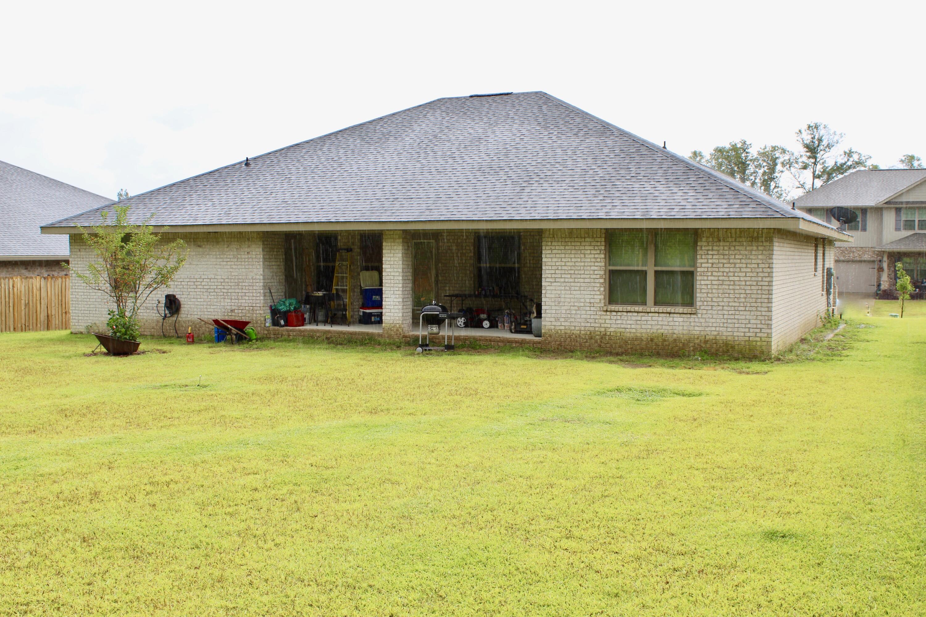5759 Marigold Loop Crestview, FL 32539 - Photo 29 of 29 a front view of a house with a patio