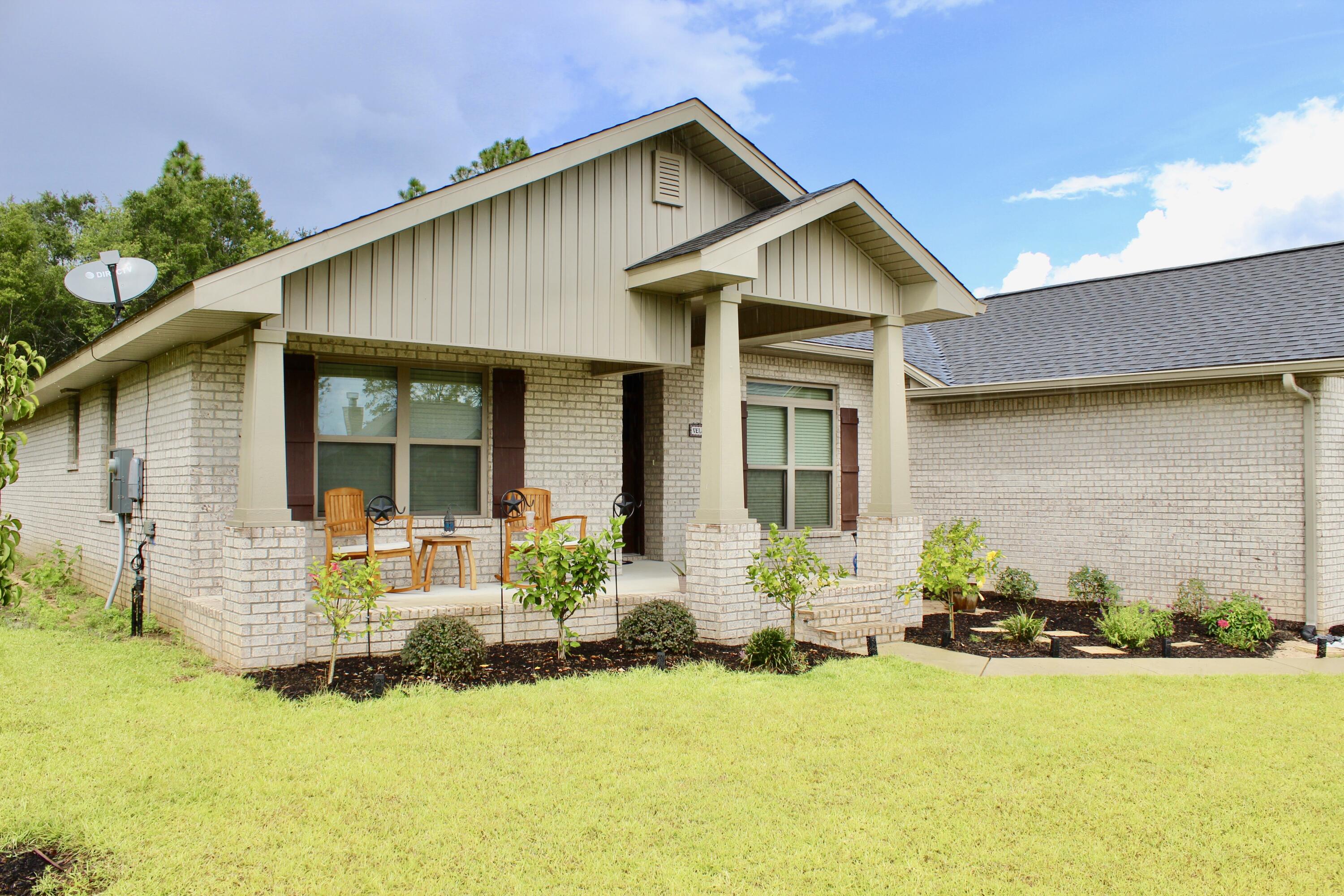 5759 Marigold Loop Crestview, FL 32539 - Photo 3 of 29 a front view of a house with patio