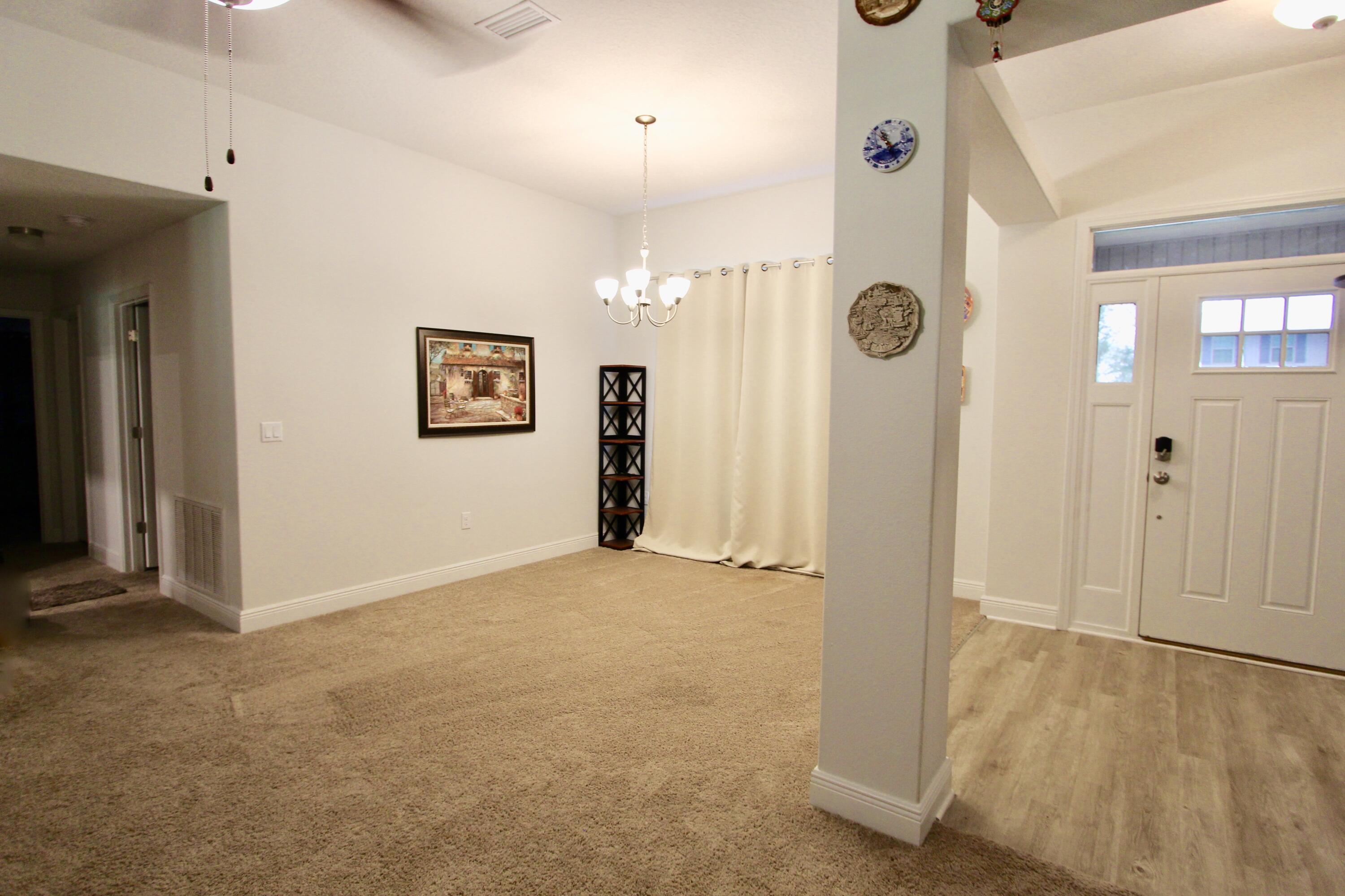 5759 Marigold Loop Crestview, FL 32539 - Photo 6 of 29 wooden floor in an empty room