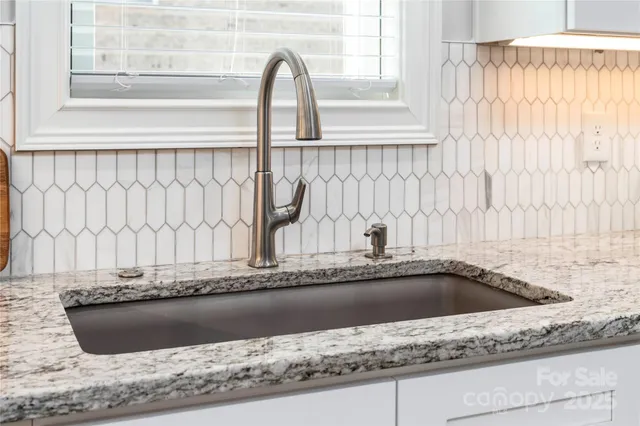 a view of a sink and a window