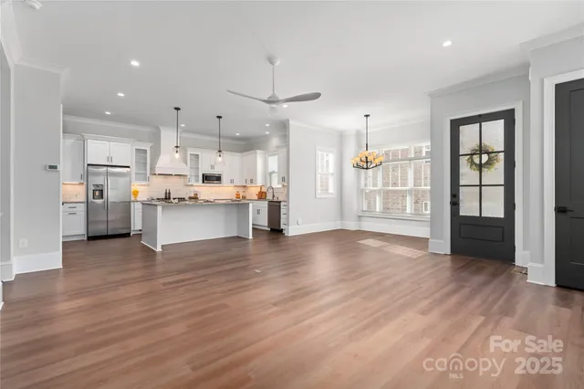 a view of kitchen with wooden floor and window