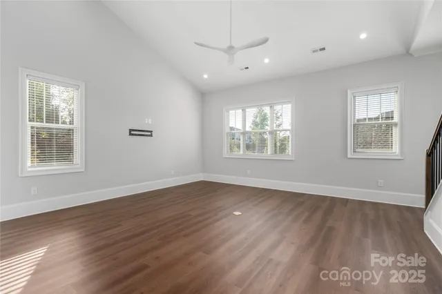 a view of kitchen with wooden floor and electronic appliances