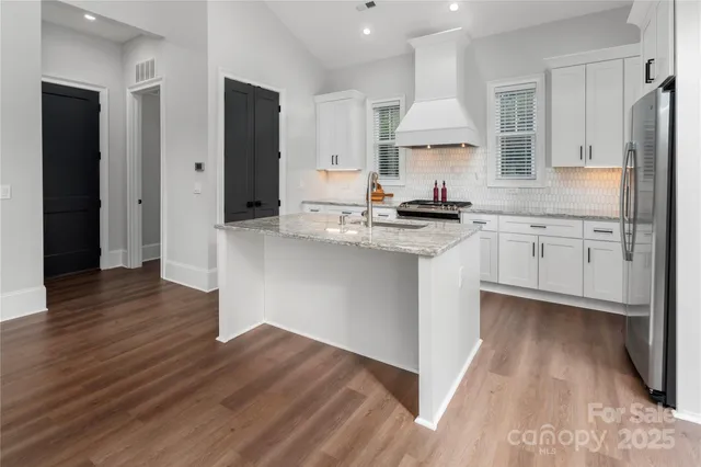 a kitchen with a sink and cabinets